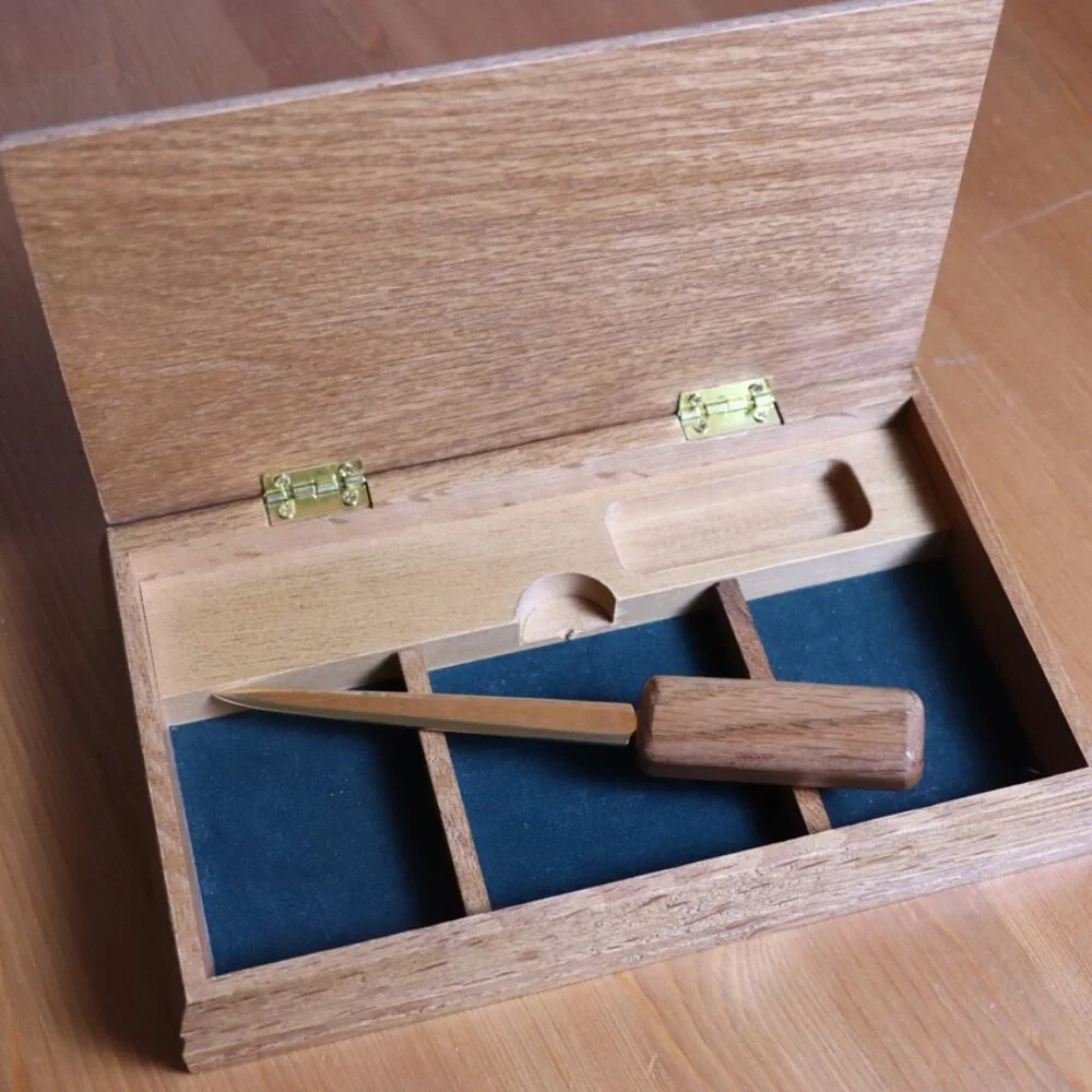 Wooden box for desk with letter opener, small carved fish on top, lid opens,